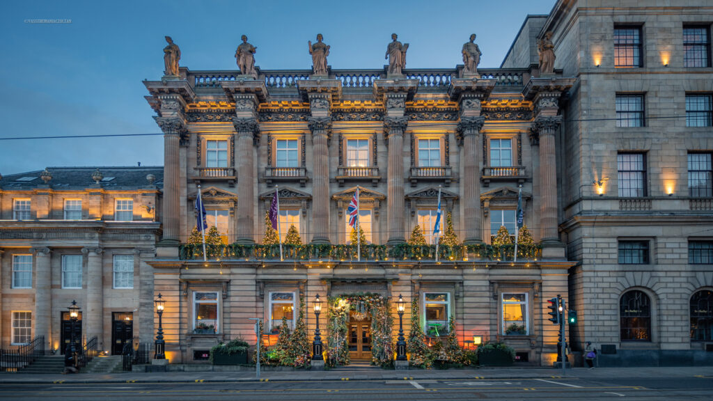 The grand historic neoclassical stone facade of the Gleneagles Townhouse hotel on St Andrew Square in Edinburgh.