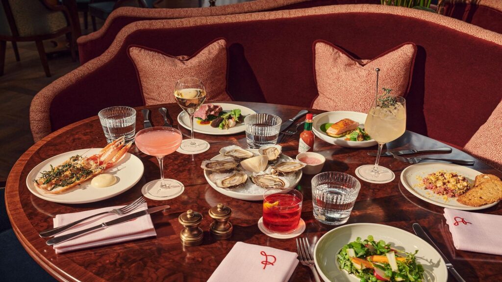 A lavish brunch buffet spread at Gleneagles Townhouse featuring fresh Scottish seafood, cured meats, and artisan cheeses.